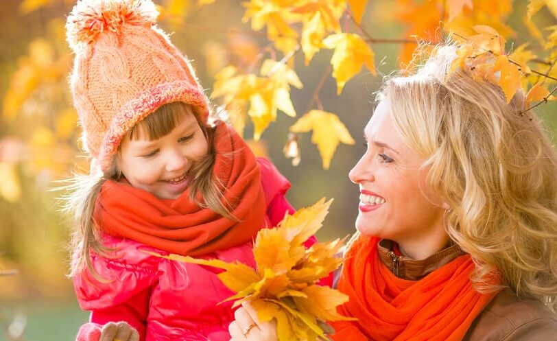 Happy family outdoor in fall or autumn