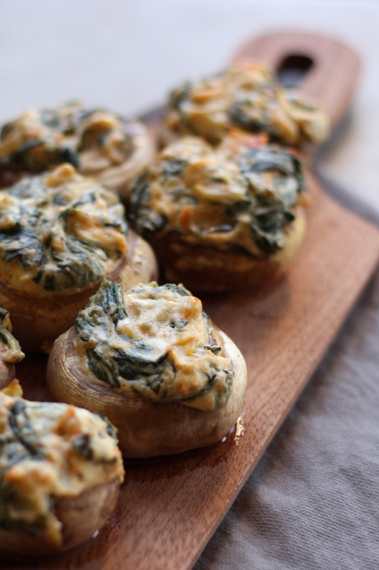 Spinach and Artichoke Stuffed Mushrooms are great for holiday gatherings 