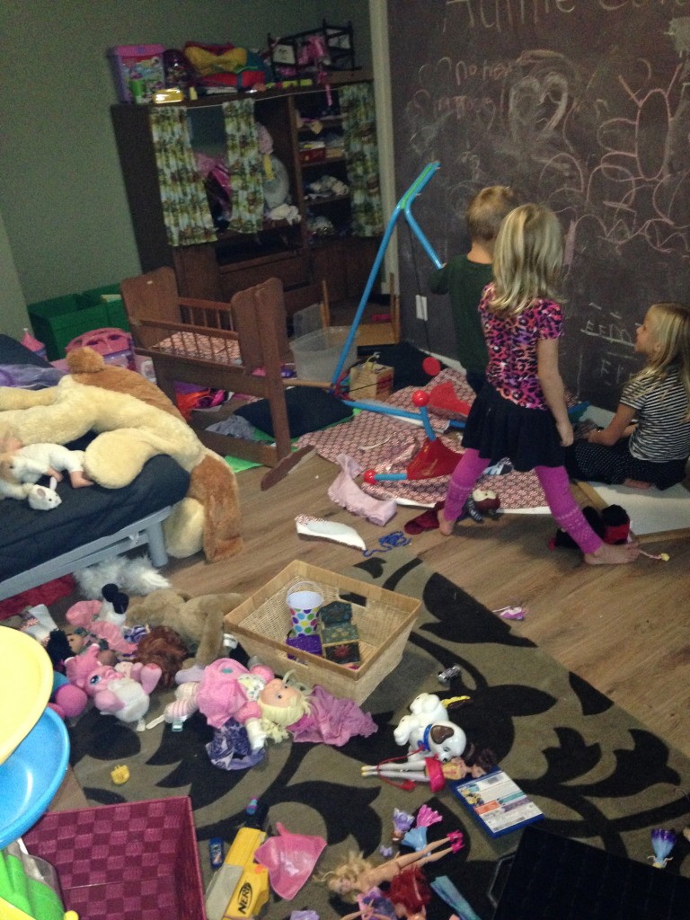 n this picture, you can see my oldest daughter teaching her little sister and their friend how to read. Great, right? (You can ALSO see why they chose that particular activity: it was too messy in there to do anything else. Don’t feel bad for them, though. Who do you think made that mess?)