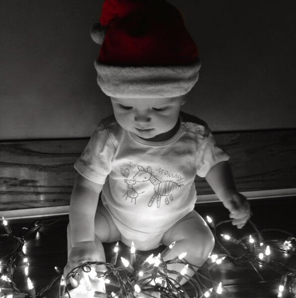 Baby and Christmas lights